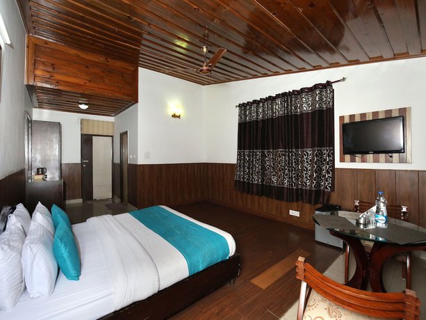 Imagen de la habitación del Hotel OYO 9660 Blossom Resort. Foto 15