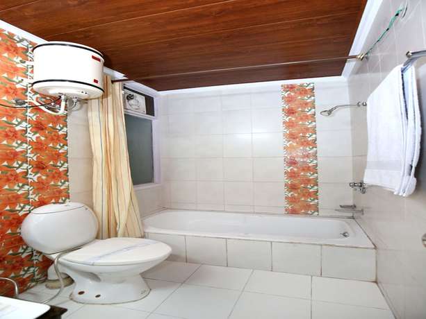 Imagen de la habitación del Hotel OYO 9660 Blossom Resort. Foto 16