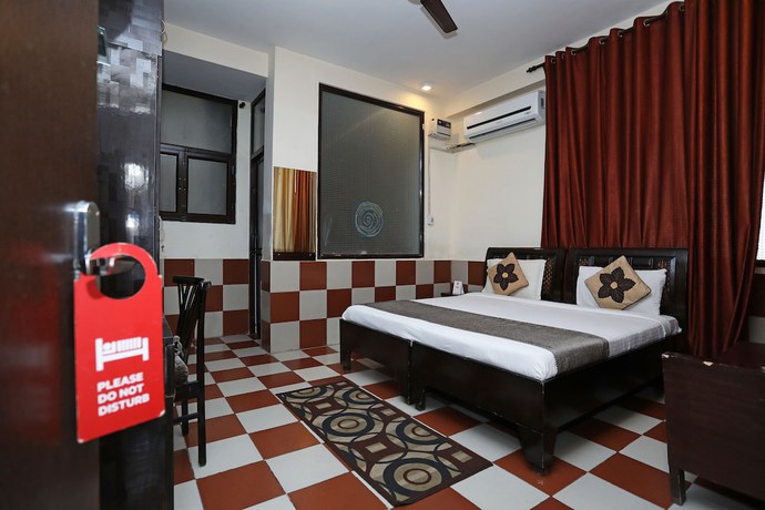 Imagen de la habitación del Hotel OYO 9705 Grand Empire Expressway. Foto 7