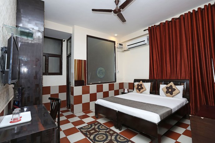 Imagen de la habitación del Hotel OYO 9705 Grand Empire Expressway. Foto 11
