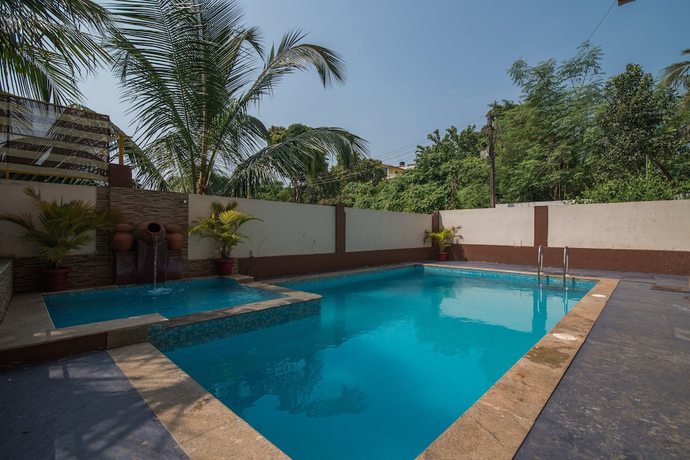 Imagen de la piscina del Hotel OYO 9913 Nova De Goa. Foto 19