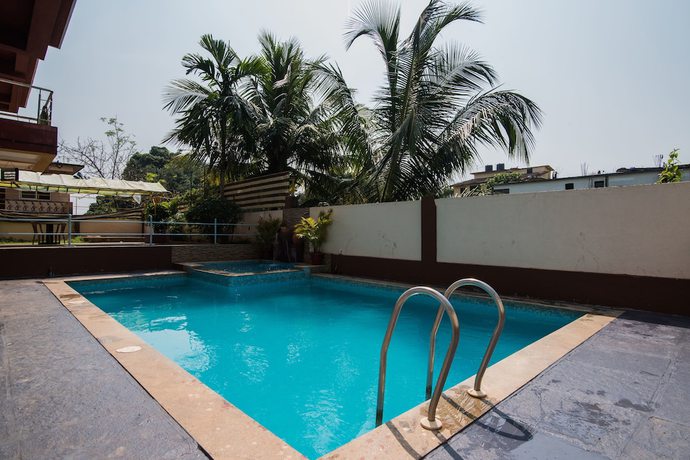 Imagen de la piscina del Hotel OYO 9913 Nova De Goa. Foto 20