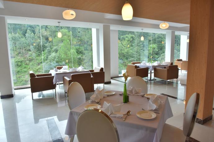 Imagen del bar/restaurante del Hotel OYO 997 Eutopia. Foto 5