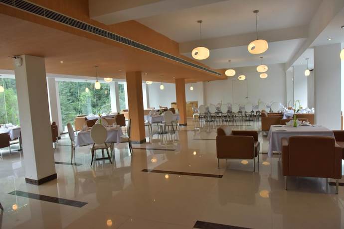 Imagen del bar/restaurante del Hotel OYO 997 Eutopia. Foto 8