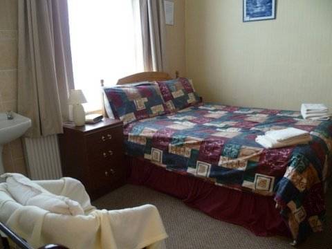 Imagen de la habitación del Hotel OYO Belvedere Guest House. Foto 11