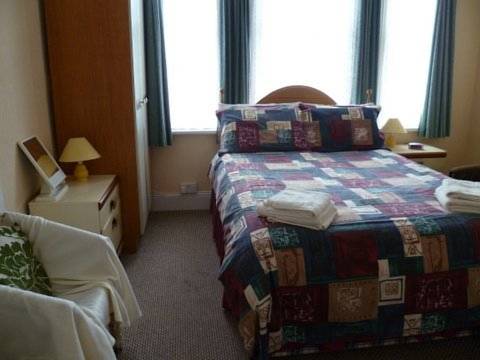 Imagen de la habitación del Hotel OYO Belvedere Guest House. Foto 12
