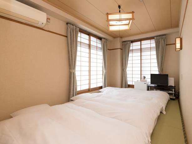 Imagen de la habitación del Hotel OYO Business Hotel Koyo. Foto 5
