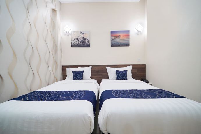 Imagen de la habitación del Hotel OYO Capital O 89647 Atta Hotel. Foto 7