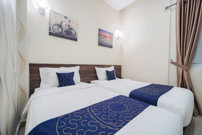 Imagen de la habitación del Hotel OYO Capital O 89647 Atta Hotel. Foto 9