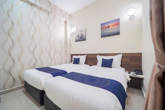Imagen de la habitación del Hotel OYO Capital O 89647 Atta Hotel. Foto 10