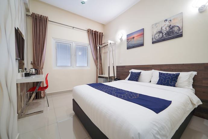 Imagen de la habitación del Hotel OYO Capital O 89647 Atta Hotel. Foto 11