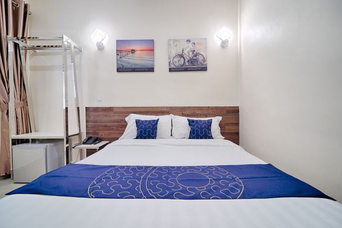 Imagen de la habitación del Hotel OYO Capital O 89647 Atta Hotel. Foto 15