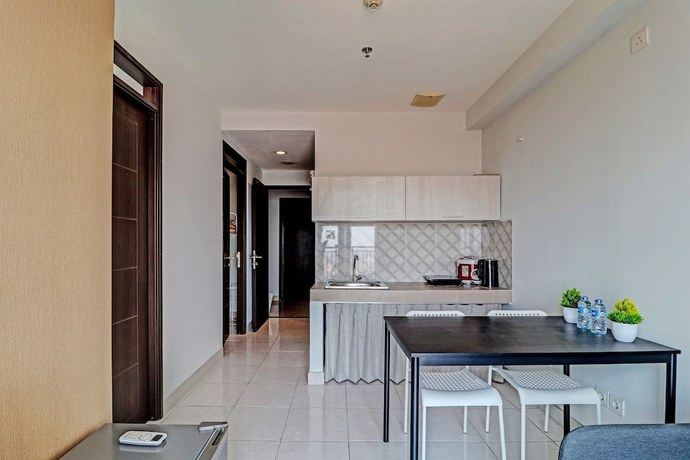Imagen de la habitación del Hotel OYO Capital O 91631 M-square Apartement. Foto 2