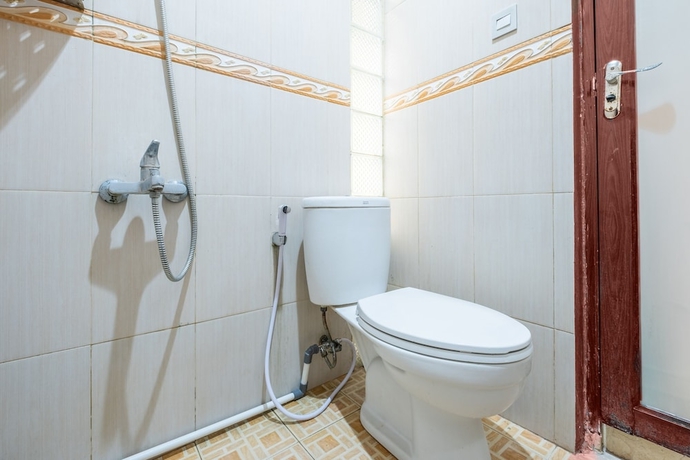Imagen de la habitación del Hotel OYO Collection O 1032 Rahayu Residence Syariah. Foto 12