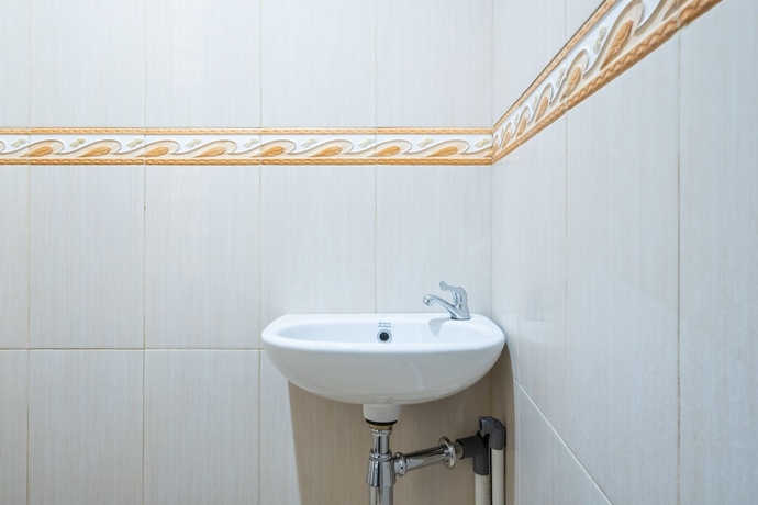 Imagen de la habitación del Hotel OYO Collection O 1032 Rahayu Residence Syariah. Foto 13