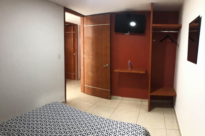 Imagen de la habitación del Hotel OYO Familiar Tollan. Foto 2