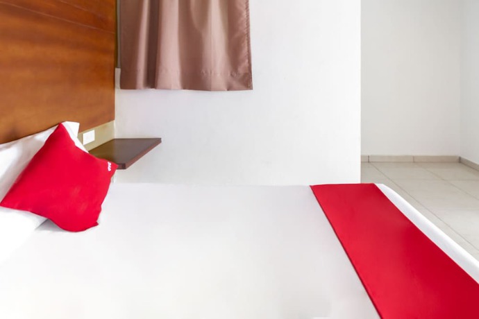 Imagen de la habitación del Hotel OYO Familiar Tollan. Foto 11