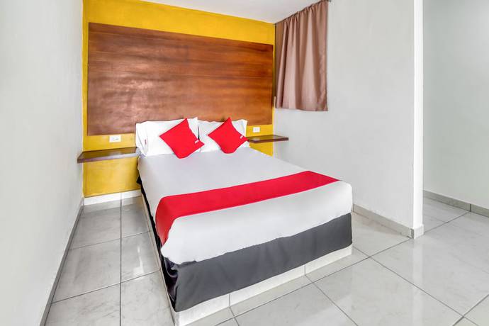 Imagen de la habitación del Hotel OYO Familiar Tollan. Foto 13
