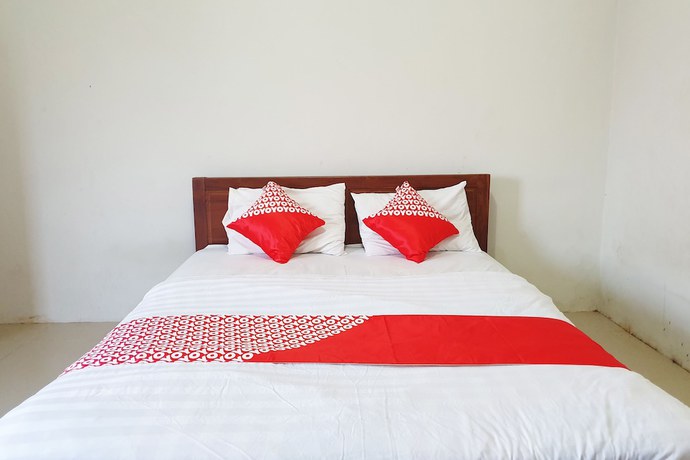 Imagen de la habitación del Hotel OYO Flagship 1034 Pondok Mulia Guest House Syariah. Foto 6