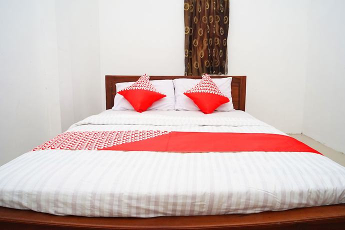 Imagen de la habitación del Hotel OYO Flagship 1034 Pondok Mulia Guest House Syariah. Foto 10