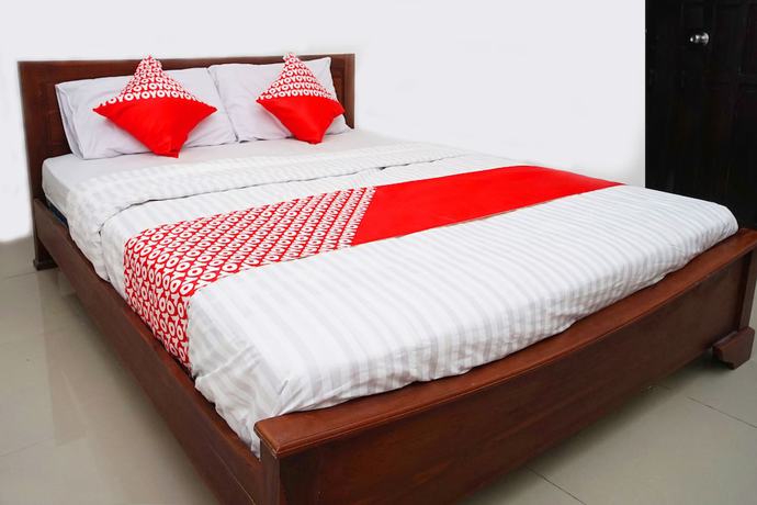 Imagen de la habitación del Hotel OYO Flagship 1034 Pondok Mulia Guest House Syariah. Foto 12