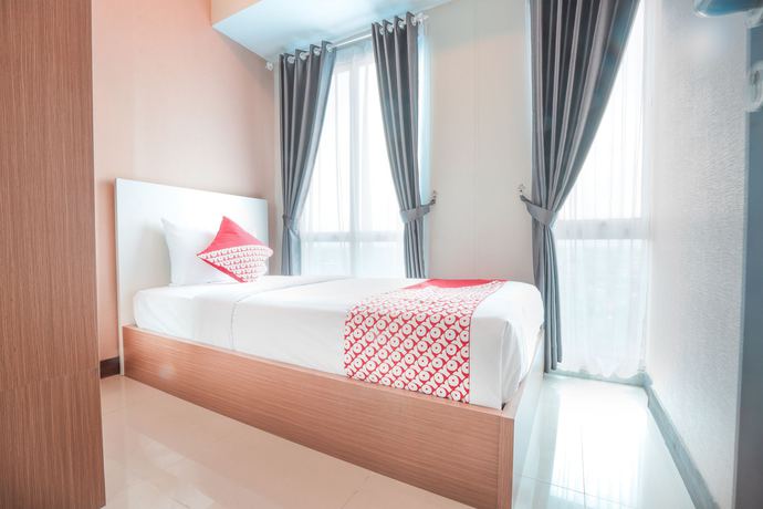 Imagen de la habitación del Hotel OYO Flagship 755 Appartel Grand Dhika City. Foto 2