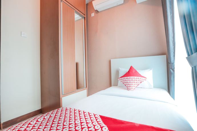 Imagen de la habitación del Hotel OYO Flagship 755 Appartel Grand Dhika City. Foto 8