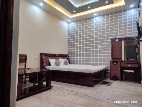 Imagen de la habitación del Hotel OYO Flagship Grand Village. Foto 19