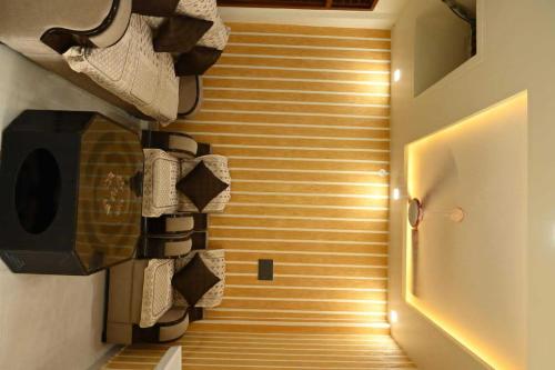 Imagen de la habitación del Hotel OYO Flagship Grand Village. Foto 20