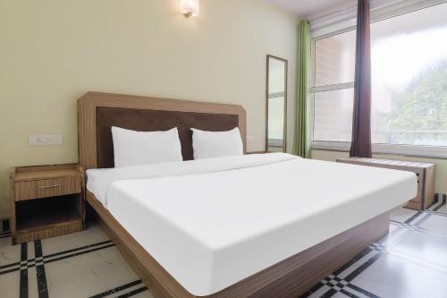 Imagen de la habitación del Hotel OYO Flagship Kavi Home Stay. Foto 20