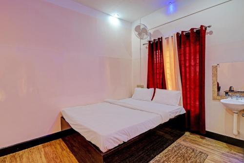 Imagen de la habitación del Hotel OYO Ganapati Bhawan Homestay. Foto 19