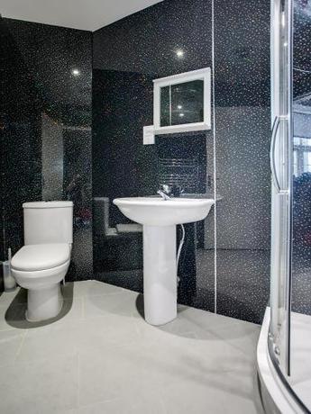 Imagen de la habitación del Hotel OYO Gin House. Foto 6