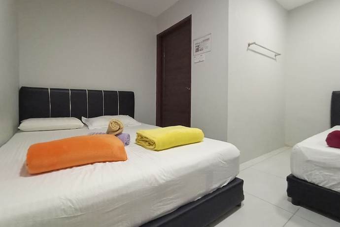 Imagen de la habitación del Hotel OYO HOME 90261 Hom2rex Kuching Homestay. Foto 1