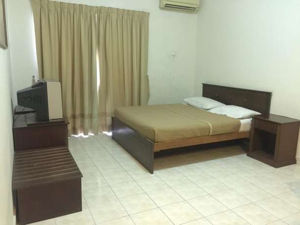 Imagen de la habitación del Hotel OYO HOME 90301 Suria Service Apartments @ Bukit Merak Laketown Resort. Foto 6
