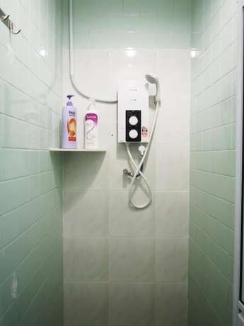 Imagen de la habitación del Hotel OYO HOME 90647 Mac Inn 94. Foto 4