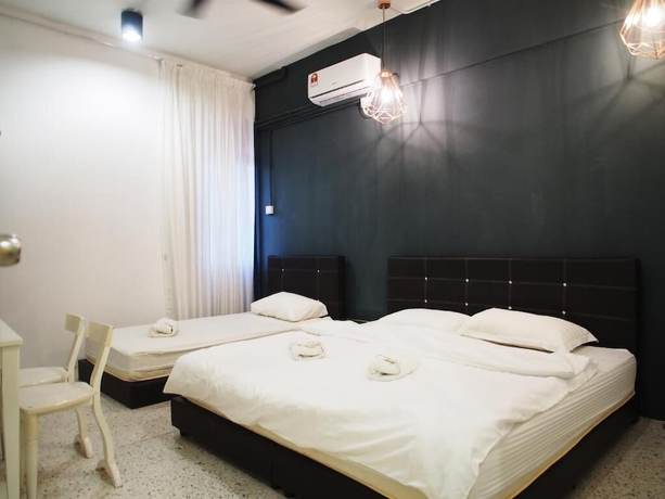Imagen de la habitación del Hotel OYO HOME 90647 Mac Inn 94. Foto 6