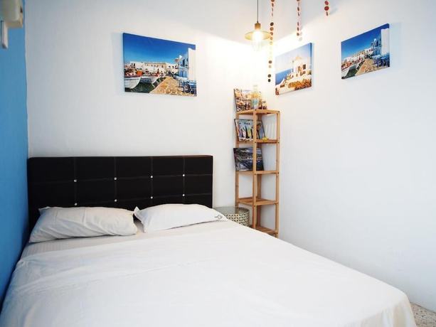 Imagen de la habitación del Hotel OYO HOME 90647 Mac Inn 94. Foto 14