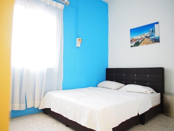 Imagen de la habitación del Hotel OYO HOME 90647 Mac Inn 94. Foto 18