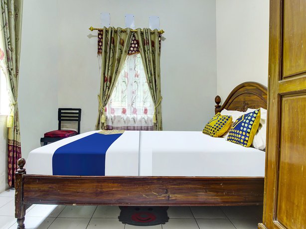 Imagen de la habitación del Hotel OYO HOMES 91242 Desa Wisata Cibuntu Kuningan Syariah. Foto 6