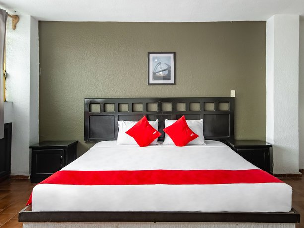 Imagen de la habitación del Hotel OYO Halley. Foto 2