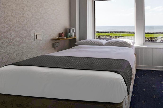 Imagen de la habitación del Hotel OYO Harlands. Foto 2