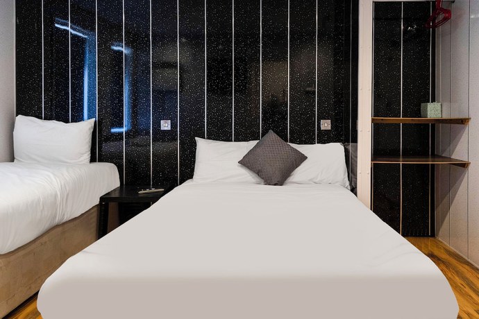 Imagen de la habitación del Hotel OYO Harlands. Foto 4
