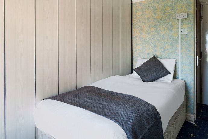 Imagen de la habitación del Hotel OYO Harlands. Foto 10
