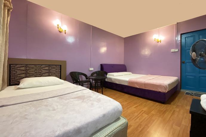 Imagen de la habitación del Hotel OYO Home 90285 Pogimpaan Homestay. Foto 4