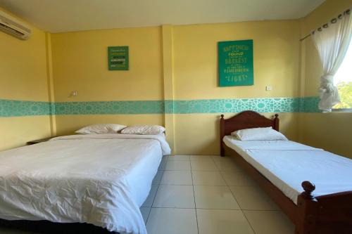 Imagen de la habitación del Hotel OYO Home 90287 Rb Homestay & Farms. Foto 18