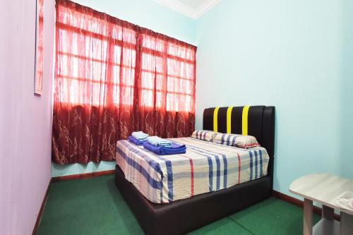 Imagen de la habitación del Hotel OYO Home 90339 Sosodikon Inap Desa. Foto 19