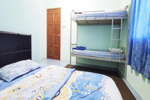 Imagen de la habitación del Hotel OYO Home 90339 Sosodikon Inap Desa. Foto 20