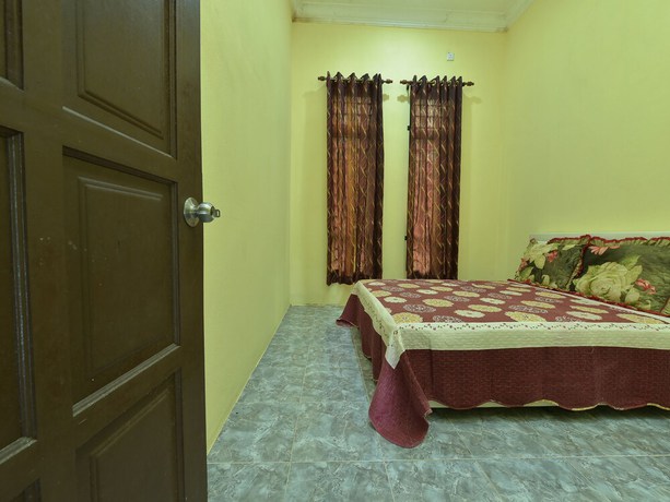 Imagen de la habitación del Hotel OYO Home 90607 Casaria Besut. Foto 5