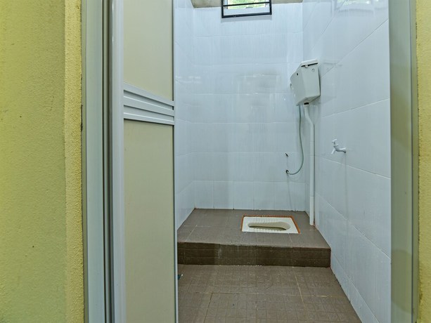 Imagen de la habitación del Hotel OYO Home 90607 Casaria Besut. Foto 9