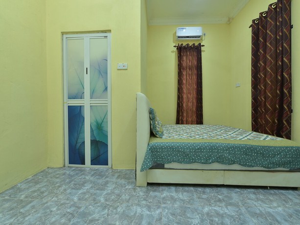 Imagen de la habitación del Hotel OYO Home 90607 Casaria Besut. Foto 11